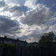 ooo purdy little clouds.... dont look like much yet... but my shoulder says i dont need to water the plants tonight